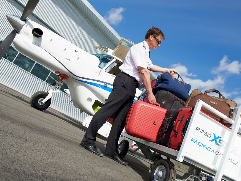 Pilot loading luggage